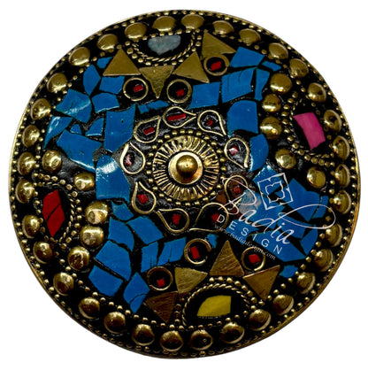 Areal View of Decorative round object with mosaic design and gold accents.