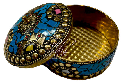 Decorative box with mosaic design and gold accents with open lid and gold interior.