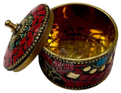 Decorative container with mosaic design, open lid and gold accents, featuring the brand &
