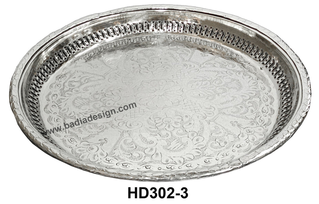 Decorative silver tray with intricate patterns on a white background, featuring the brand &