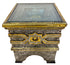 An ornate square side table with a glass top, featuring intricate silver filigree and gold accents, set against a plain white background.