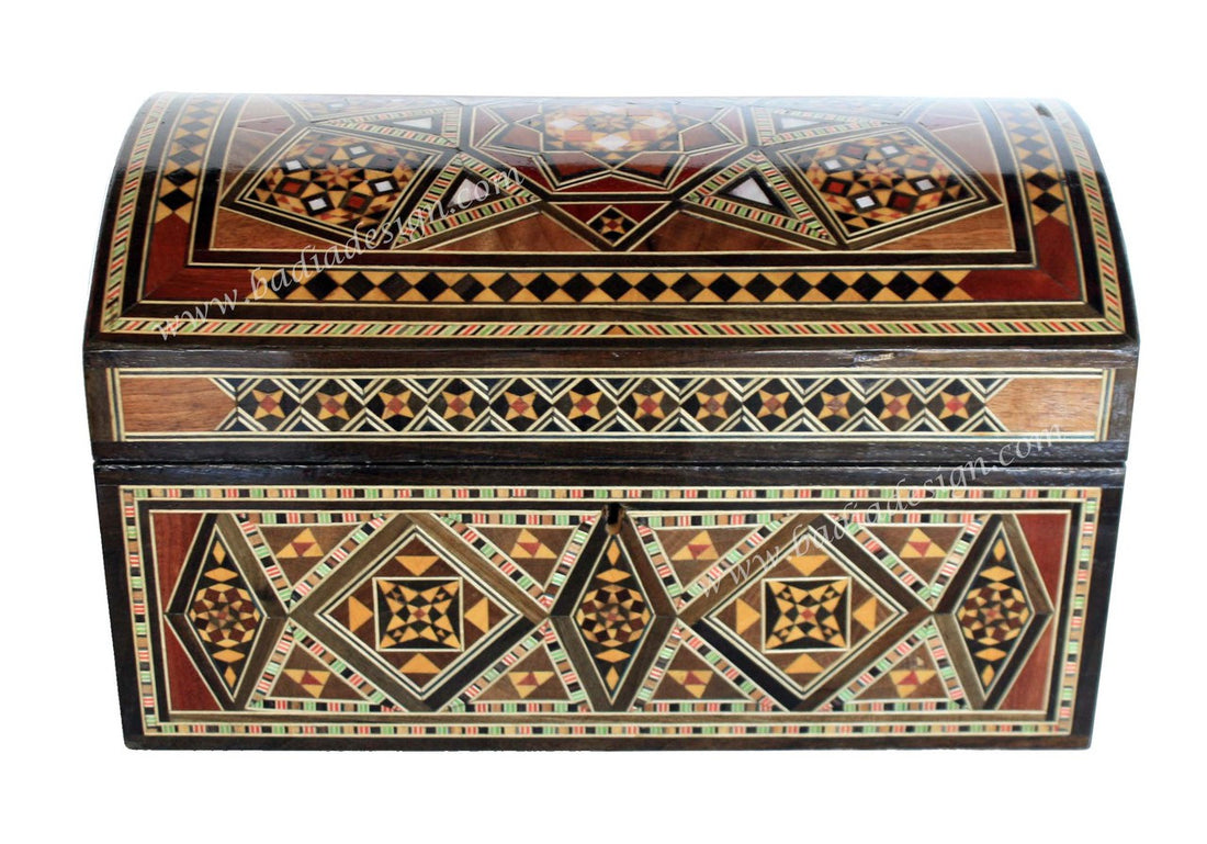 Decorative wooden box with geometric patterns on a white background
