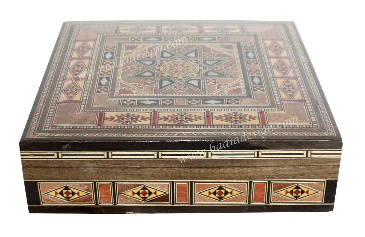 Decorative wooden box with geometric patterns on a white background