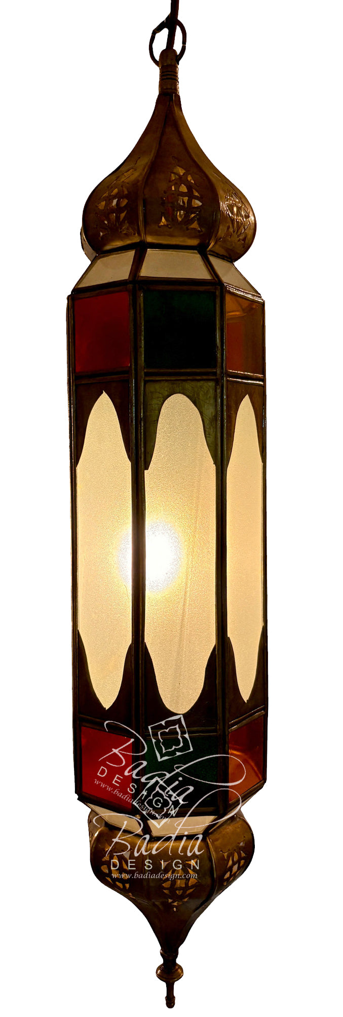 A hanging Moroccan-style stained glass lantern with a warm glowing light inside, featuring geometric panels in amber, red, green, and cream glass on a white background.