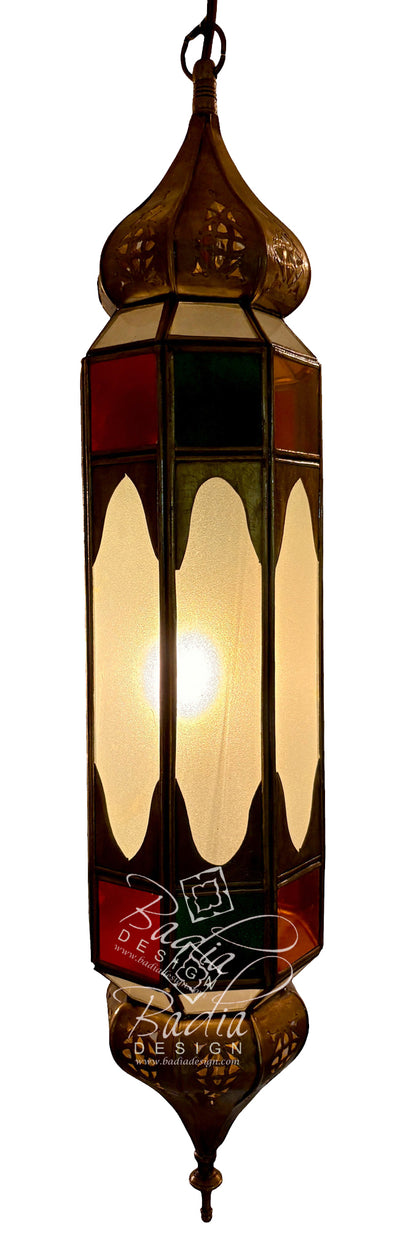 A hanging Moroccan-style stained glass lantern with a warm glowing light inside, featuring geometric panels in amber, red, green, and cream glass on a white background.