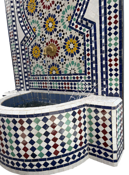 Mosaic-tiled fountain with geometric and floral patterns