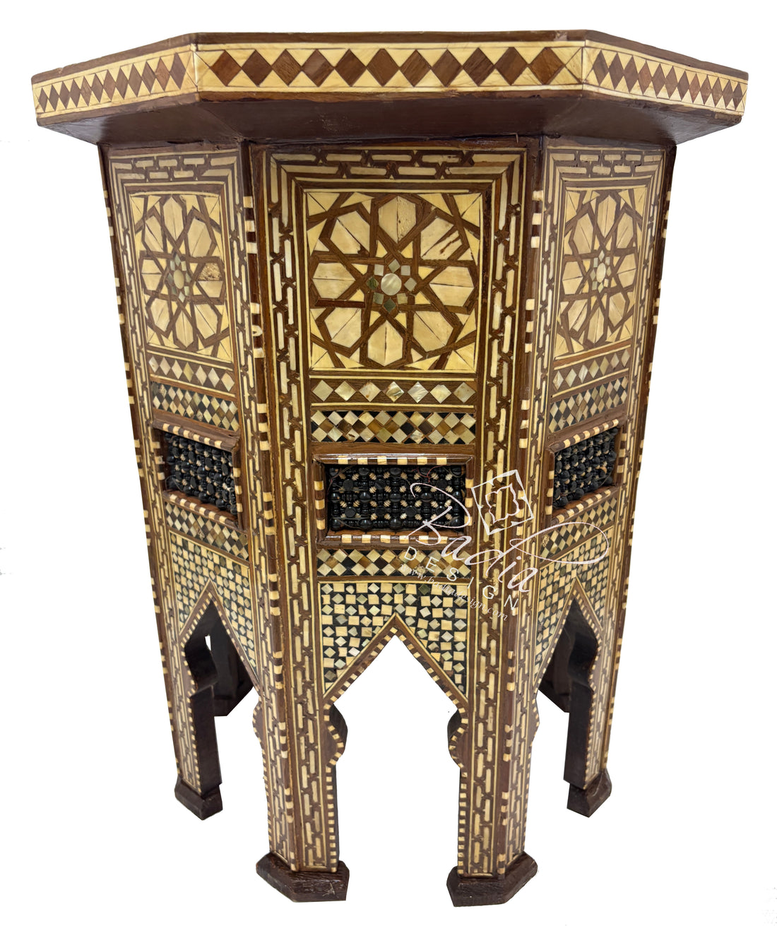 Decorative wooden side table with intricate patterns on a white background