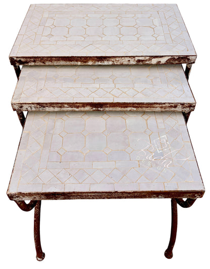 A three-tier nesting side table with distressed white mosaic tile tops and dark brown metal legs, shown against a plain white background.