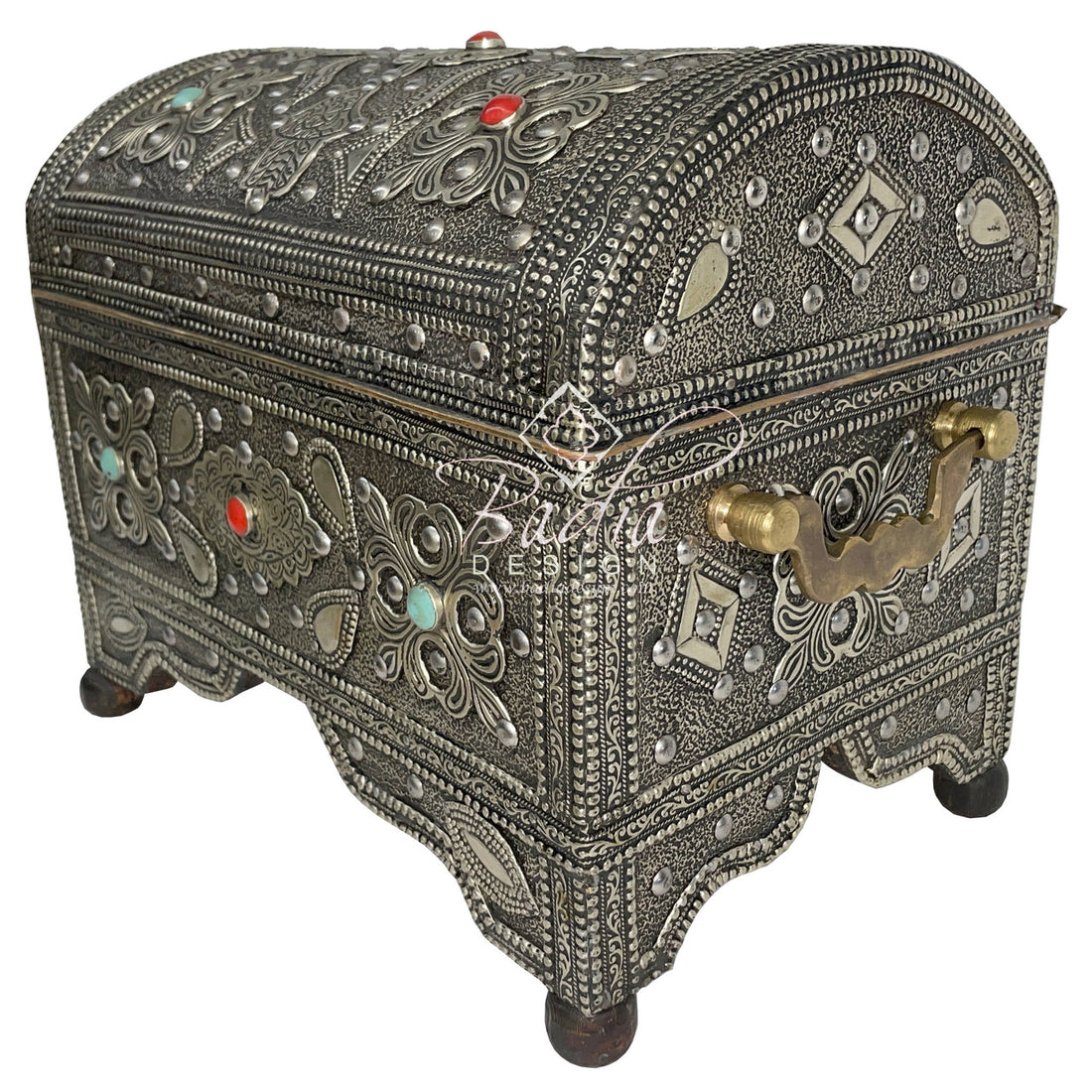 Decorative silver jewelry box with intricate designs and gemstones on a white background