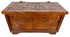 An ornate carved wooden chest with intricate geometric and floral engravings on the lid and front panels, shown against a plain white background.