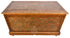 An ornate rectangular wooden storage chest or trunk with carved geometric and floral patterns, featuring a warm brown finish and decorative inlays, shown against a plain white background.