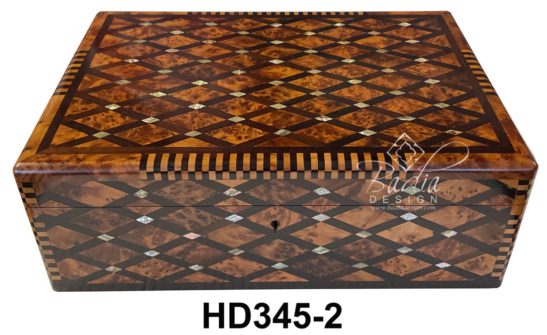 Wooden jewelry box with intricate inlay design on a white background, featuring the brand &