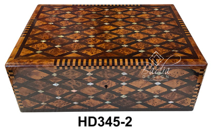 Wooden jewelry box with intricate inlay design on a white background, featuring the brand &