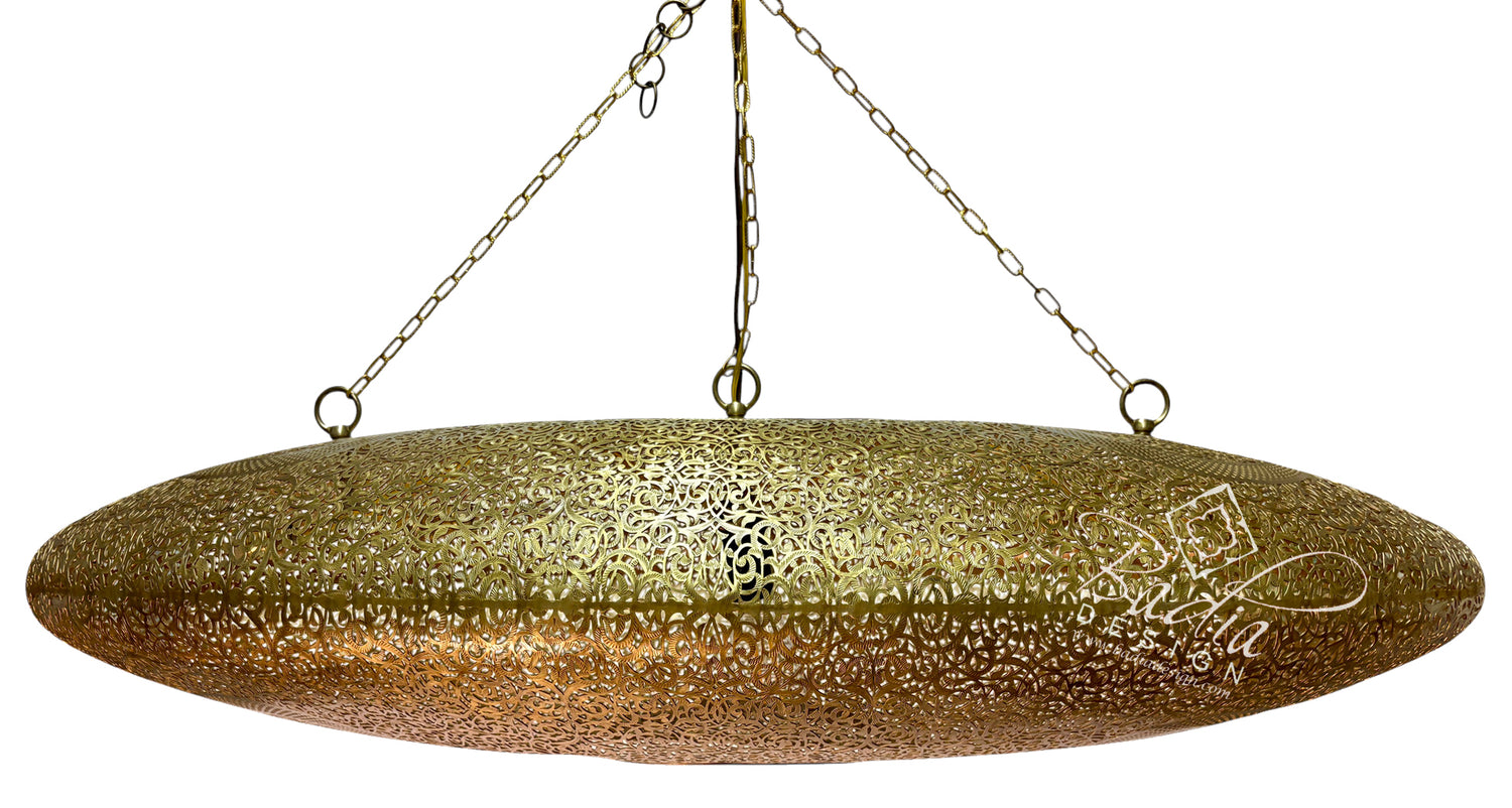 A large, oval-shaped hanging pendant light with a textured, hammered metallic gold finish, suspended by chains against a plain white background.